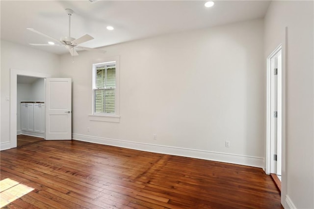 unfurnished bedroom featuring dark wood-type flooring and ceiling fan