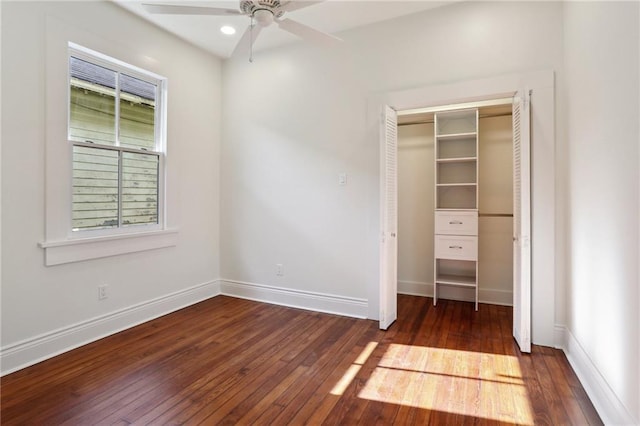 unfurnished bedroom featuring dark hardwood / wood-style flooring and a closet