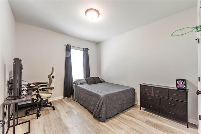 bedroom with light hardwood / wood-style flooring