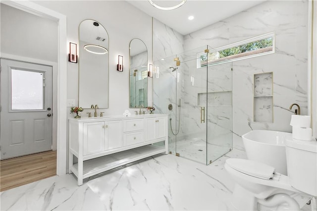 bathroom featuring plus walk in shower and vanity