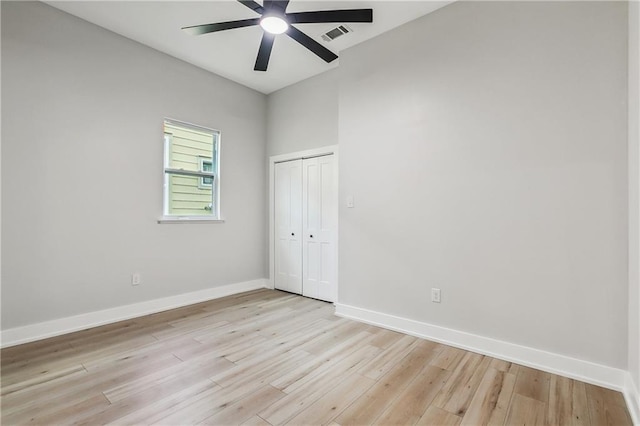 spare room featuring ceiling fan and light wood-type flooring