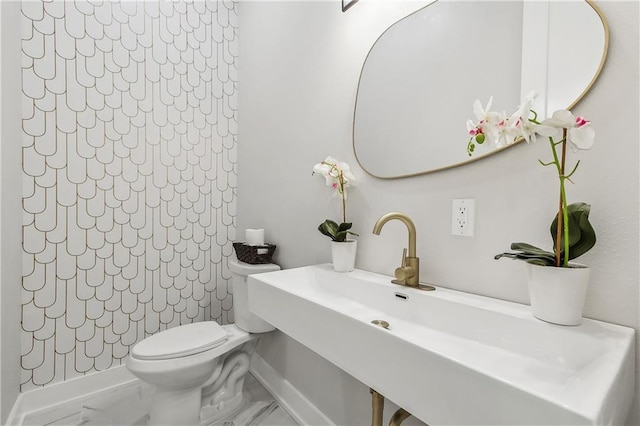 bathroom with toilet and sink