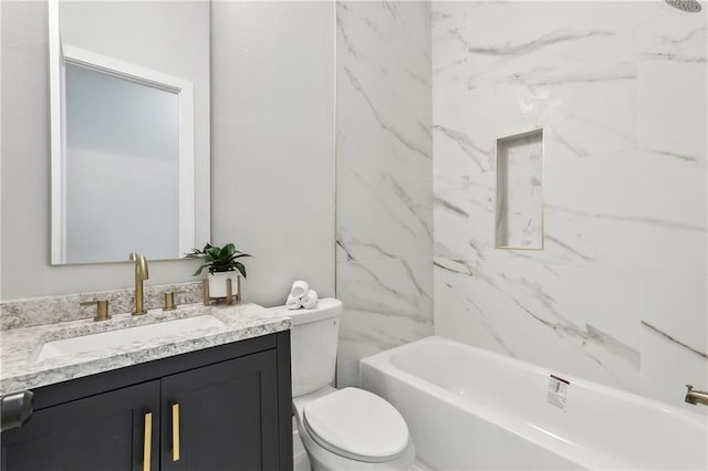 full bathroom with vanity, toilet, and tiled shower / bath