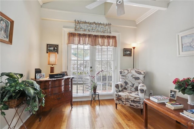 living area with light hardwood / wood-style flooring, ornamental molding, french doors, and ceiling fan