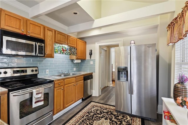 kitchen featuring sink, appliances with stainless steel finishes, dark hardwood / wood-style flooring, beamed ceiling, and backsplash