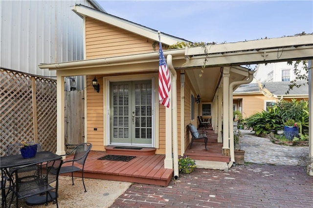 rear view of property featuring a patio and french doors