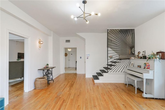 interior space with wood-type flooring and a chandelier