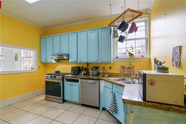 kitchen featuring blue cabinetry, stainless steel appliances, crown molding, and sink