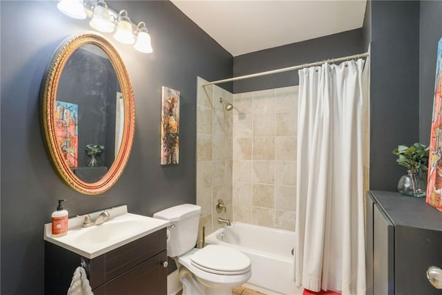 full bathroom featuring vanity, shower / bath combo with shower curtain, and toilet