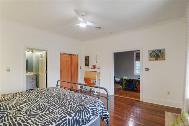 bedroom featuring crown molding, ceiling fan, connected bathroom, and dark hardwood / wood-style flooring