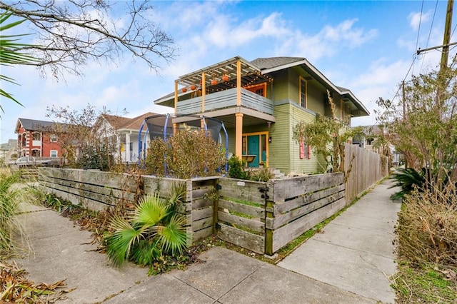 view of front of property with a balcony