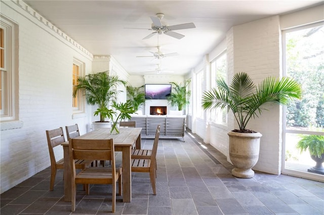 interior space with ceiling fan