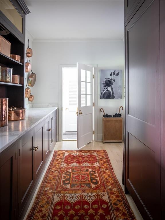 interior space with crown molding