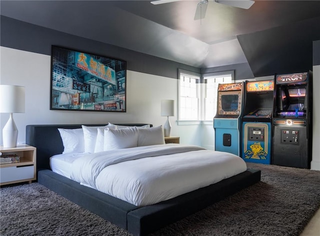 bedroom with vaulted ceiling, carpet flooring, and ceiling fan