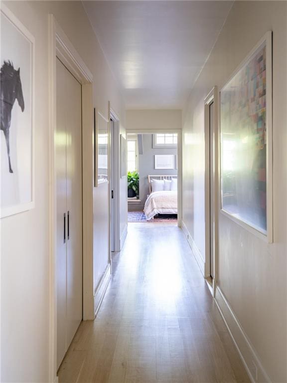 hallway featuring light hardwood / wood-style flooring