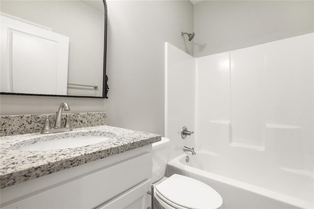 full bathroom featuring vanity, shower / washtub combination, and toilet