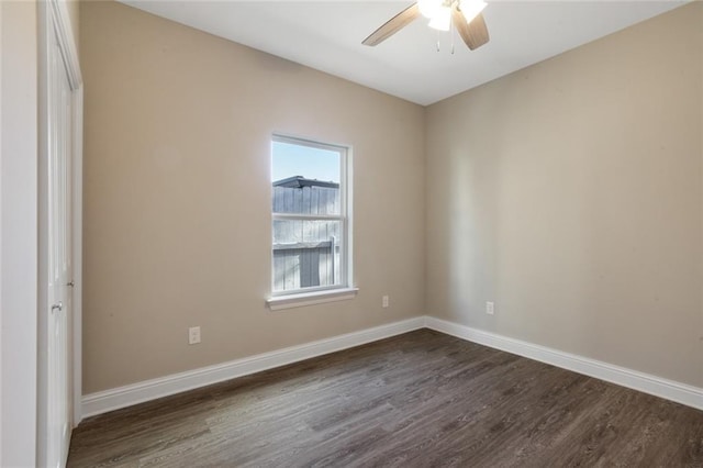 unfurnished room featuring dark wood-type flooring and ceiling fan