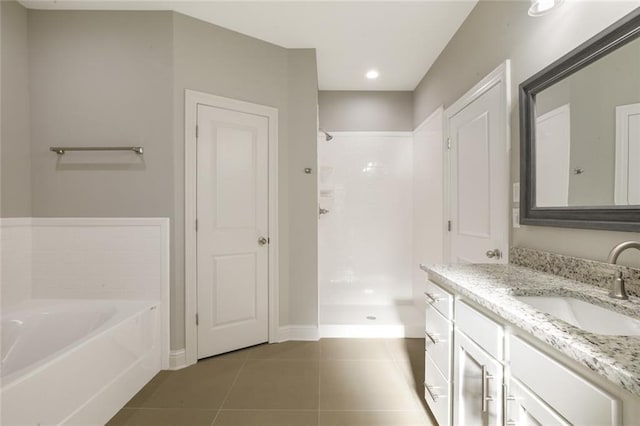 bathroom featuring tile patterned floors, separate shower and tub, and vanity