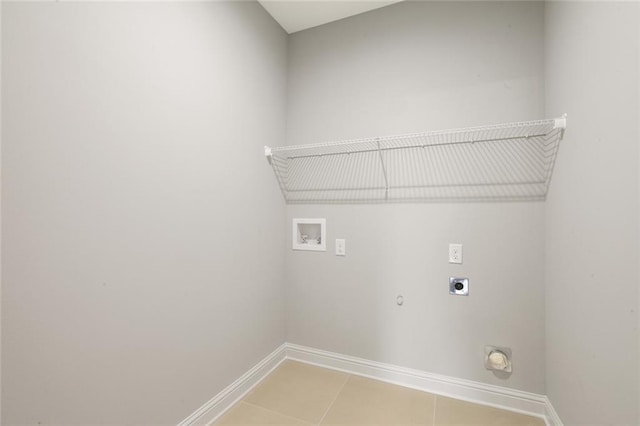 clothes washing area featuring electric dryer hookup, hookup for a washing machine, tile patterned floors, and gas dryer hookup