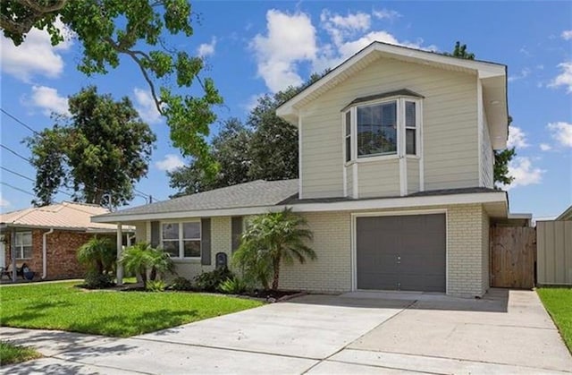 view of front of home with a garage and a front yard