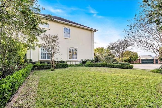 view of home's exterior featuring a lawn