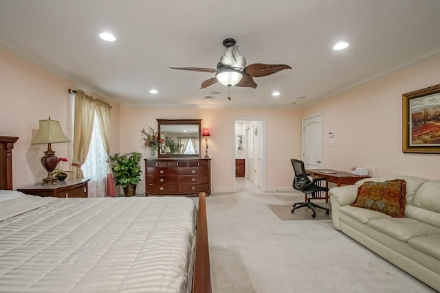 carpeted bedroom featuring crown molding and ensuite bathroom