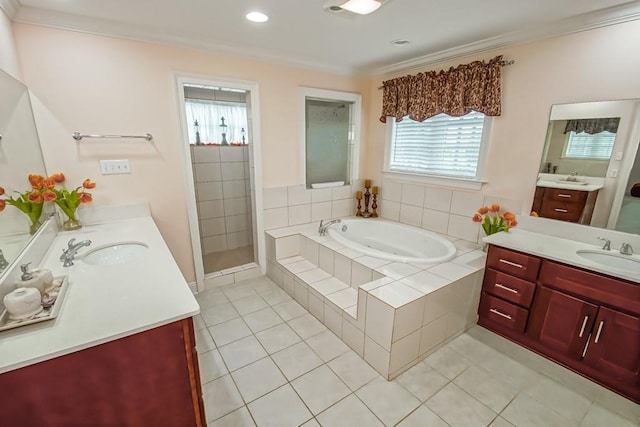 bathroom featuring vanity, ornamental molding, tile patterned floors, and independent shower and bath