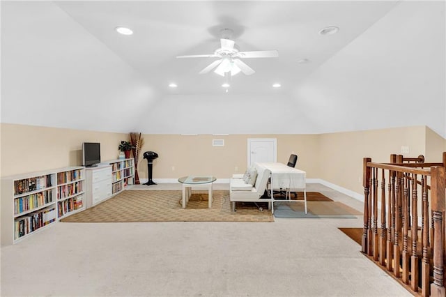 sitting room featuring lofted ceiling, light colored carpet, and ceiling fan