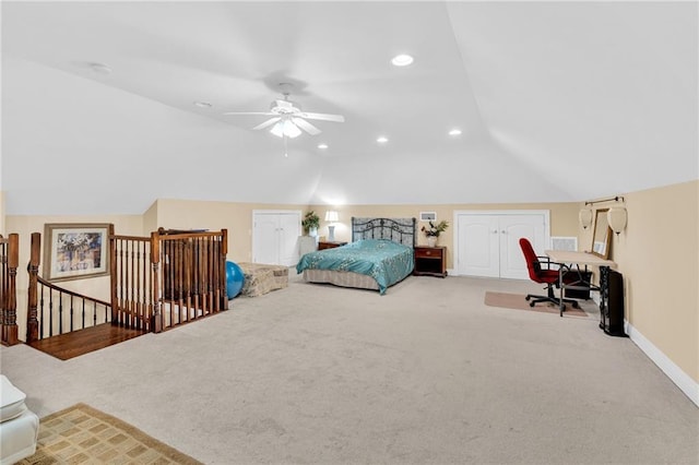 bedroom with vaulted ceiling, ceiling fan, and carpet flooring