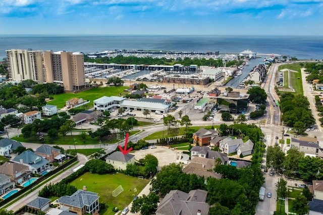 birds eye view of property with a water view