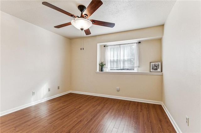 unfurnished room featuring hardwood / wood-style floors and ceiling fan