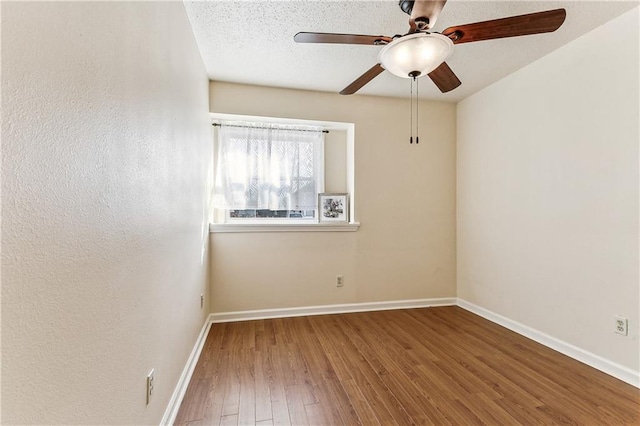 unfurnished room with hardwood / wood-style floors, a textured ceiling, and ceiling fan