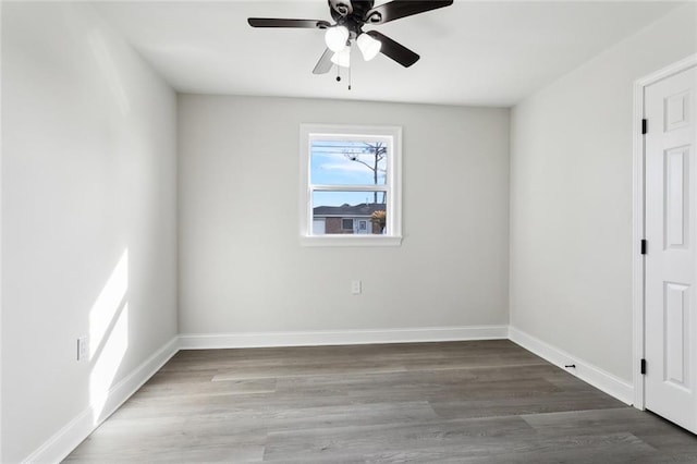 spare room featuring hardwood / wood-style floors and ceiling fan