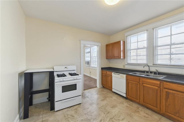 kitchen featuring white appliances and sink