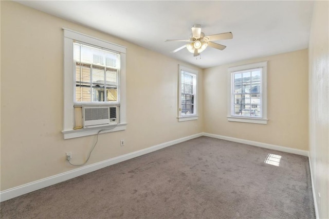 carpeted spare room featuring cooling unit and ceiling fan