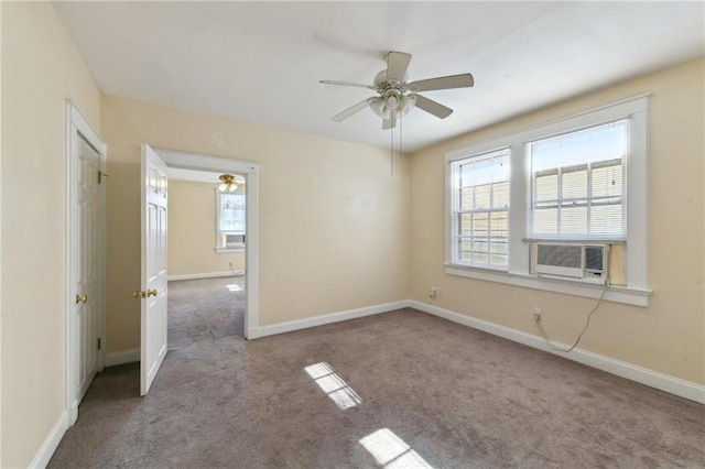 carpeted spare room with cooling unit and ceiling fan