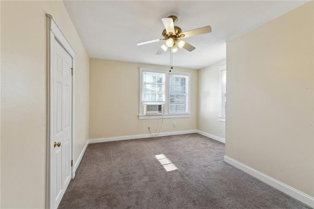 unfurnished bedroom featuring cooling unit, carpet floors, and ceiling fan