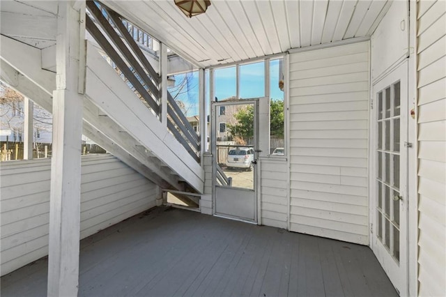 unfurnished sunroom featuring wooden ceiling