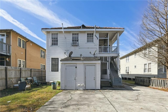 back of house with a balcony