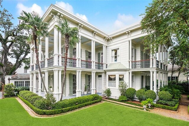 2425 Coliseum St, New Orleans, LA 70130 - neoclassical home with a front yard and a balcony