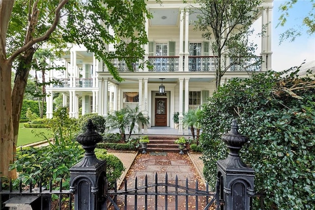 2425 Coliseum St, New Orleans, LA 70130 - entrance to property with a porch, fence, a gate, and a balcony