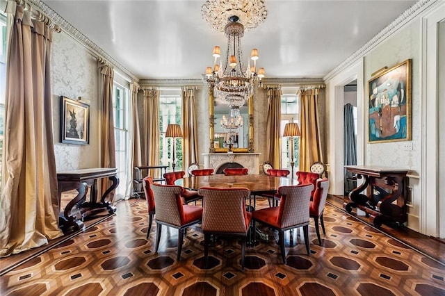 2425 Coliseum St, New Orleans, LA 70130 - dining area with wallpapered walls, a notable chandelier, and ornamental molding