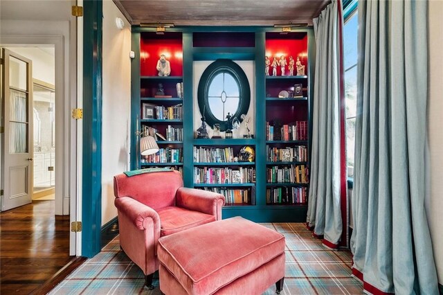 2425 Coliseum St, New Orleans, LA 70130 - living area with wood finished floors and built in shelves
