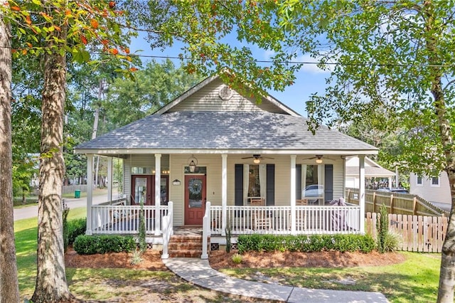 bungalow-style house with a porch and ceiling fan