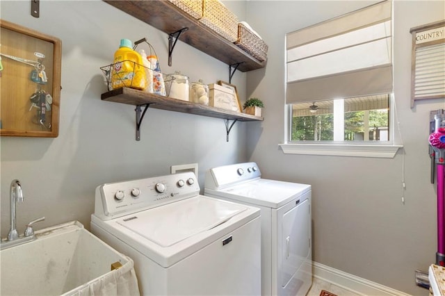 laundry area with sink and independent washer and dryer