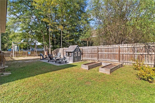 view of yard featuring a patio area and a storage unit