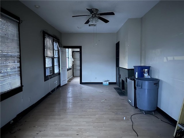 unfurnished room with hardwood / wood-style flooring and ceiling fan