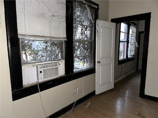 kitchen featuring hardwood / wood-style flooring and cooling unit