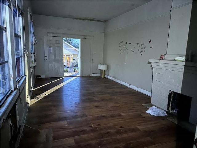 interior space featuring dark hardwood / wood-style flooring and a fireplace