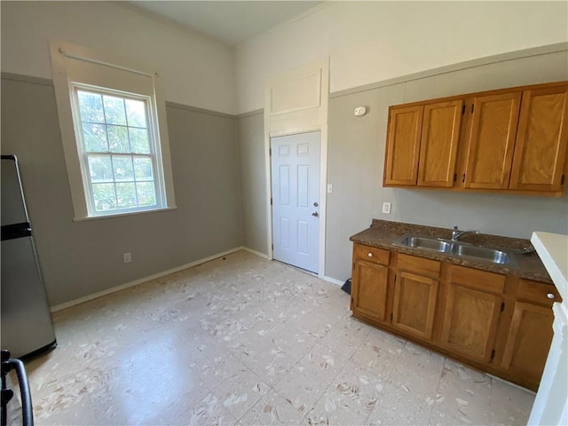 kitchen with sink and stainless steel fridge